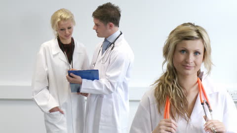 Young Doctors Collaborating and Communicating in Medical Setting