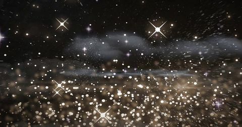 Glittering bokeh particles drifting across dark cosmic backdrop with starburst flares