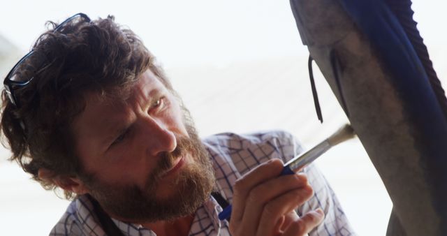 Focused Adult Male Archeologist Brushing Archaeological Find - Download Free Stock Images Pikwizard.com