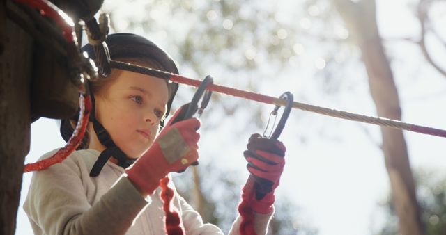 Young Girl Navigating Adventure Park with Safety Harness - Download Free Stock Images Pikwizard.com