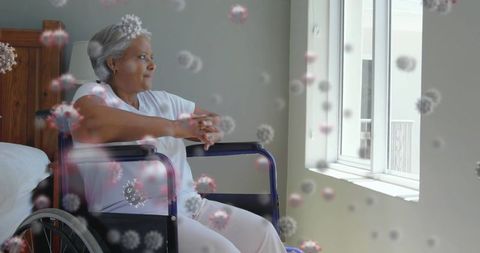 Elderly Woman in Wheelchair Surrounded by Virus Particles