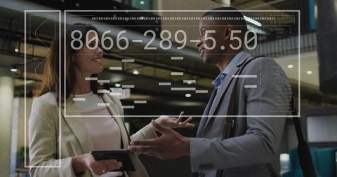 Business Professionals Discussing with Digital Interface Overlay