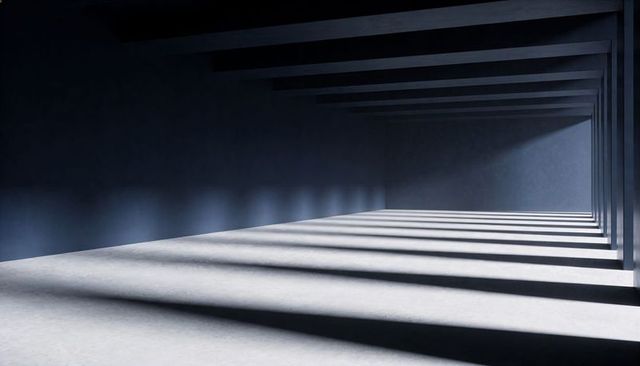 Industrial concrete corridor casting long geometric shadow bands with pillar rhythm