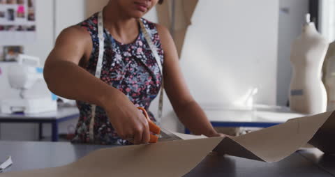 Fashion Student Cutting Patterns in Studio