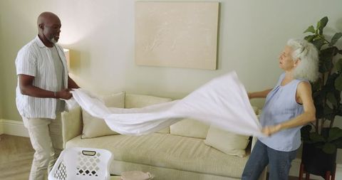 Senior couple collaborating on household chores at home