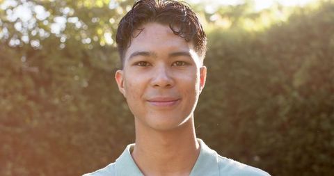 Smiling Young Man Outdoors Enjoying Sunny Day