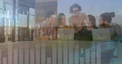 Diverse Team Analyzing Financial Data with Modern Technology