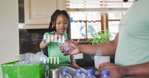 Smiling Child and Adult Recycling Plastic Bottles in Kitchen, Teaching Ecofriendly Habits