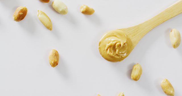 Close Up of Creamy Peanut Butter with Peanuts on White Background - Download Free Stock Images Pikwizard.com