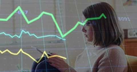 Woman Analyzing Graph on Digital Tablet at Home