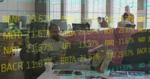Businessman analyzing digital data overlays with laptop