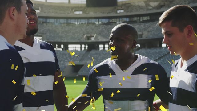 Rugby players celebrating victory with confetti falling on a stadium field. Great for promoting sports events, teamwork, sportsmanship, athletic achievement, and rugby tournaments. Ideal for advertising sports gear and success stories in sports.