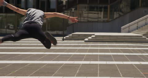 Dynamic Parkour Acrobatics in Urban Setting on Sunny Day