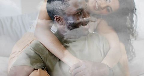 Dreamlike couple embrace with soft cloud overlay, intimate home romance, pastel warmth