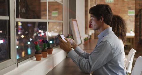 People Working with Digital Interface at Night