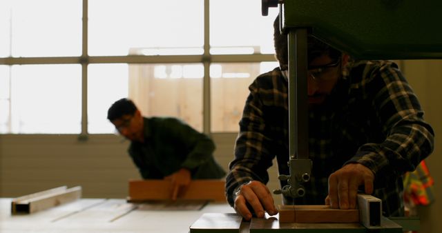 Carpenters using table saws in workshop for woodworking projects - Download Free Stock Images Pikwizard.com