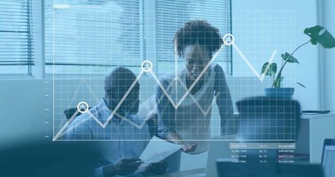 Business Professionals Analyzing Data with Overlaid Line Graph
