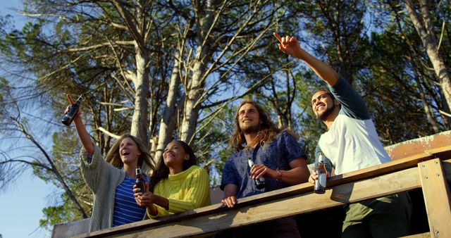 Friends Enjoying Chat While Relaxing at Rustic Cabin Deck - Download Free Stock Images Pikwizard.com