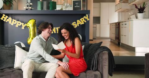 Happy Couple Celebrating Anniversary in Cozy Living Room