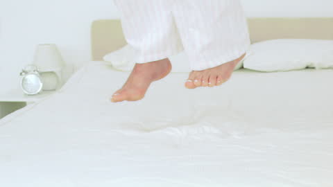 Joyful Jump of Relaxation on Soft Bed in Slow Motion