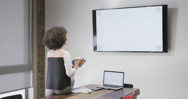 Businesswoman Preparing Presentation in Meeting Room - Download Free Stock Images Pikwizard.com