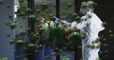 Healthcare worker in ppe confronting airborne virus through glass door pandemic concept