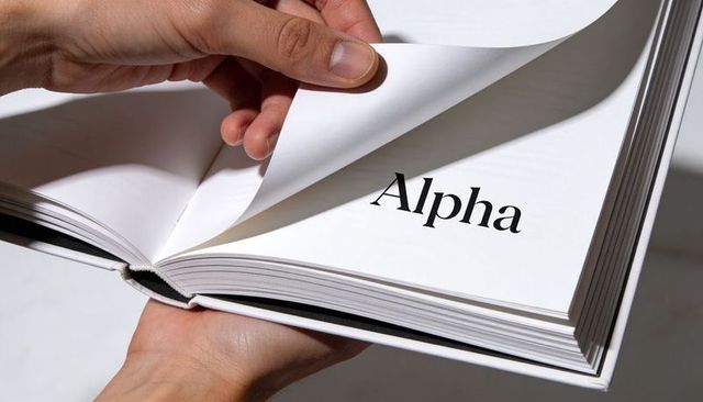 Hands Turning Hardcover Book Page Revealing Alpha Typography Minimalist Serif Design