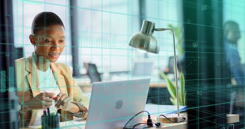 African American Businesswoman Analyzing Financial Data on Laptop - Download Free Stock Images Pikwizard.com