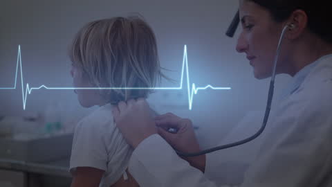 Doctor Checking Child's Heartbeat with Cardiac Monitor Display