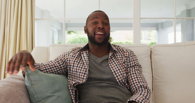 Happy Man Relaxing on Sofa in Living Room - Download Free Stock Images Pikwizard.com