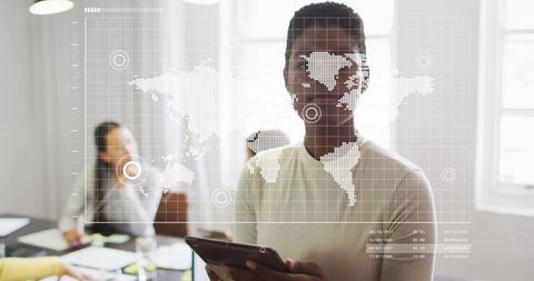 Black woman leading meeting using tablet with digital world map overlay in boardroom
