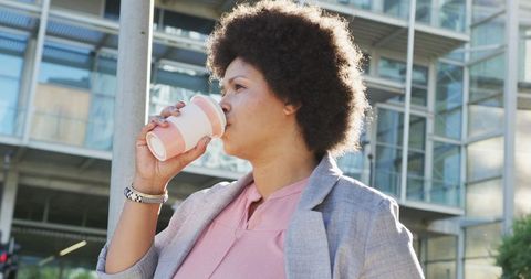 Confident Professional Drinking Coffee on City Walk