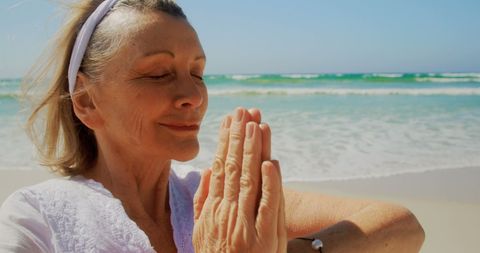 Senior Woman Meditating and Practicing Yoga on Beach - Download Free Stock Images Pikwizard.com