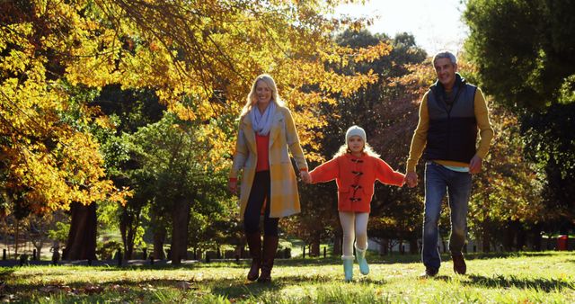 Happy Family Walking in Park During Fall - Download Free Stock Images Pikwizard.com