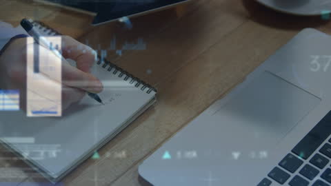 Financial Data Overlay While Writing Notes at Desk