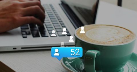 Remote work coffee break with laptop, latte mug and social notification bubble showing 52