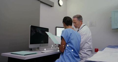 Healthcare Professionals Reviewing Patient Charts in Modern Clinic