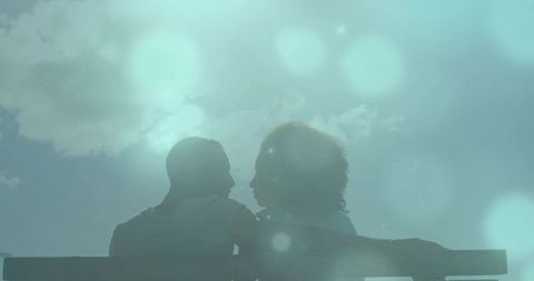 Couple Embracing Amidst Sunlit Glare with Airy Feel