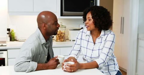 African American Couple Chatting Over Coffee in Bright Kitchen - Download Free Stock Images Pikwizard.com