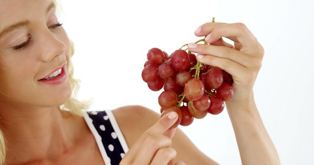Close-up of Woman Holding Fresh Red Grapes in Hand - Download Free Stock Images Pikwizard.com
