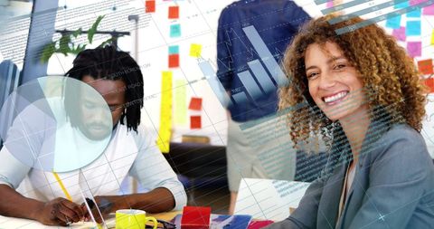 Innovative Team Analyzing Digital Financial Data in Bright Office