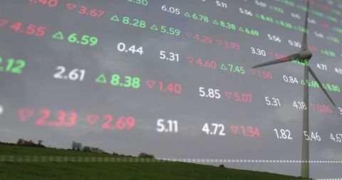 Wind Turbine in Green Field with Stock Market Data Overlay