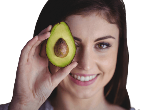 Smiling woman holding fresh avocado half transparent background