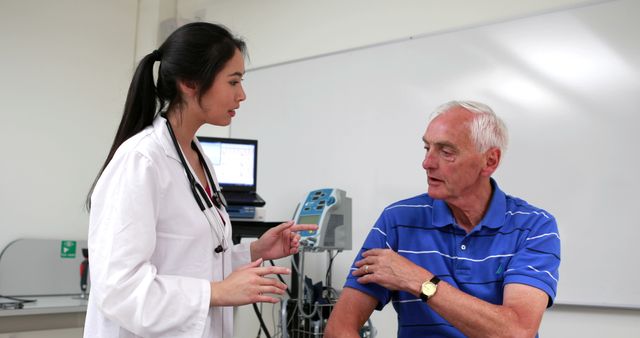 Doctor Explaining Medical Procedure to Elderly Patient in Clinic - Download Free Stock Images Pikwizard.com