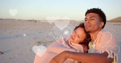 Romantic Couple Embracing on Sandy Beach at Sunset