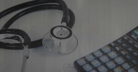 Healthcare cost analysis with stethoscope and calculator