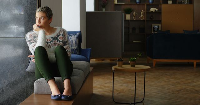 Thoughtful Woman Sitting on Bench in Modern Lounge - Download Free Stock Images Pikwizard.com