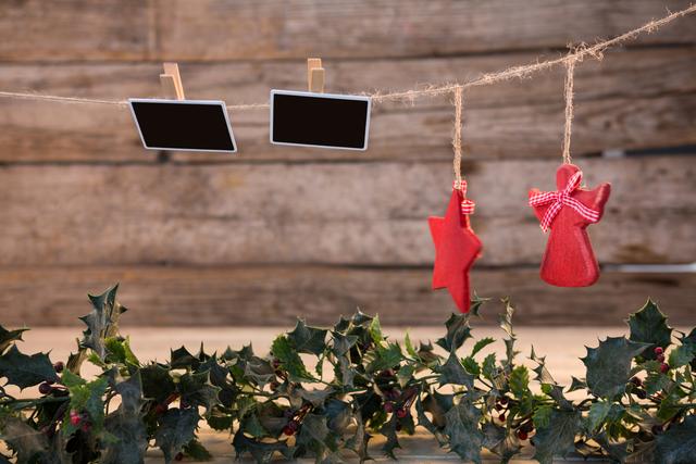 Christmas Decorations Hanging on Rustic Wooden Wall - Download Free Stock Photos Pikwizard.com