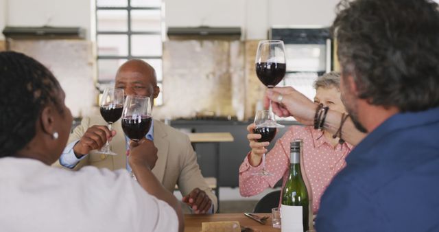 Diverse Group of Friends Enjoying Wine Together at Restaurant - Download Free Stock Images Pikwizard.com