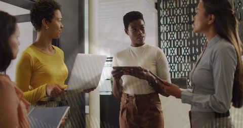 Diverse Women Collaboration in Modern Office Environment